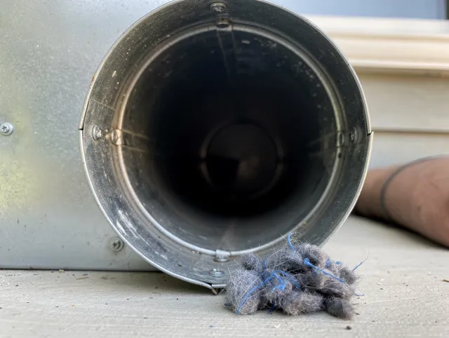 Vincent Dryer Vent Cleaning technician using specialized equipment to clear severe dryer vent blockage in Vincent